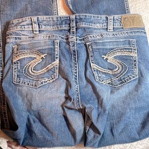 Size 36 / 33 long Silver Suki Distressed low rise bootcut jeans